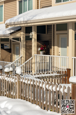 Small front yard, porch and entrance of residential townhouses on winter season in Canada