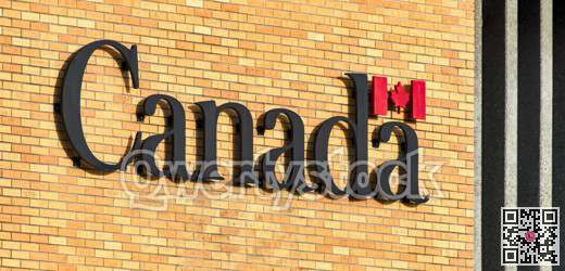 Canada. Name of the country on brick wall background