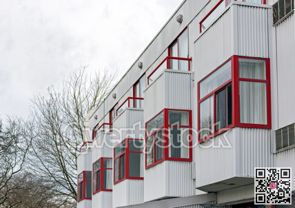 Goffer wall of residential building with erker windows in the row