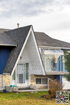 Entrance of original residential house with lighthouse over patio