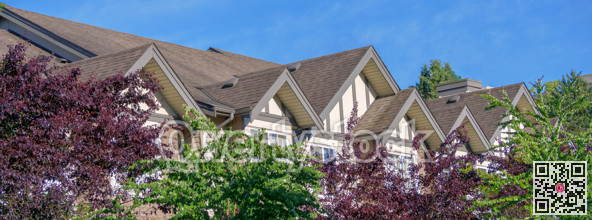 Rooftop level of residential building on blue sky background