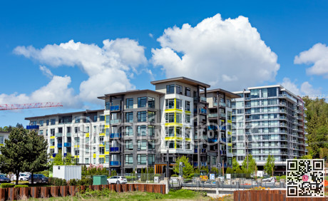 New residential buildings under construction on cloudy and blue sky background