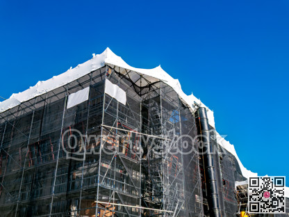 Office building under construction on blue sky background