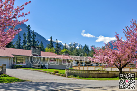 Family residential house on snow mountain and blue sky background