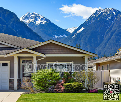 Family residential house on snow mountain and blue sky background