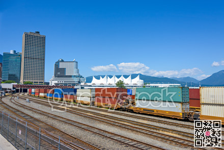 Container double cargo train going via downtown of Vancouver