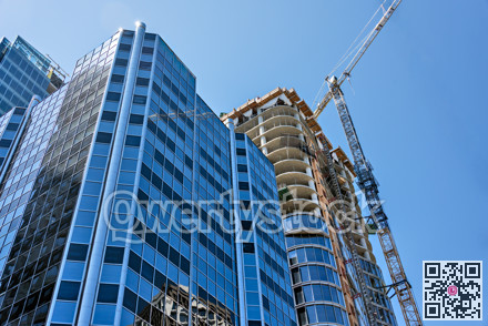 Monolite concrete building under constraction on blue sky background
