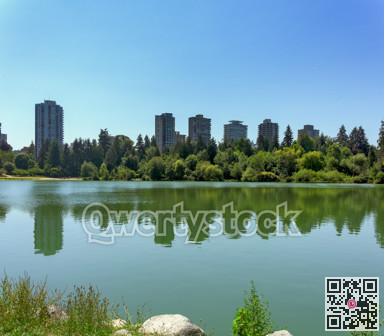 View over Lost Lagoon at old residential high-rises in downtown of Vancouver