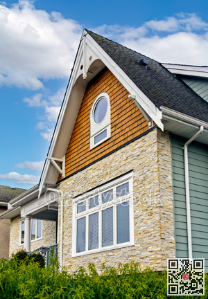 Front side of residential house on cloudy sky background in Canada